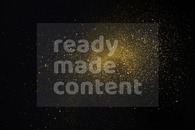 Yellow powder explosion on black background