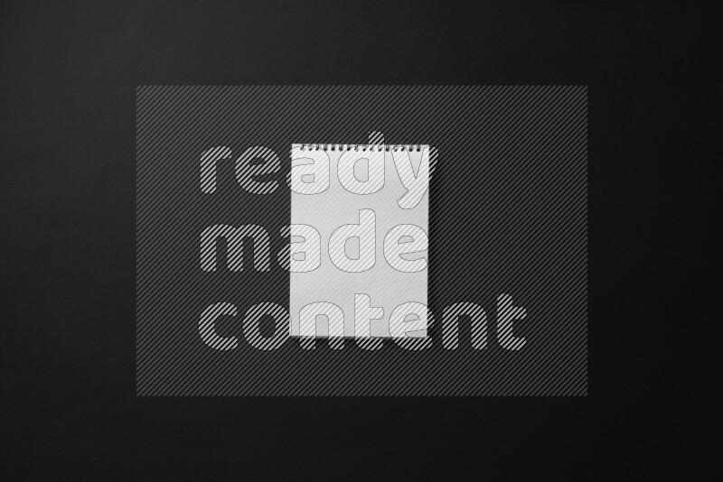 Notebook sheet on black background