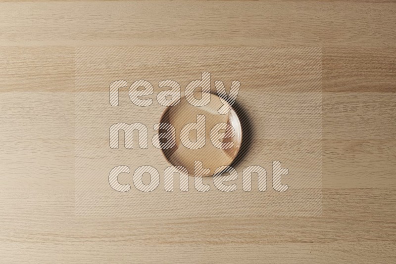 Top View Shot Of A Multicolored Pottery Plate on Oak Wooden Flooring