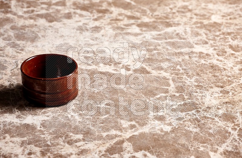 Brown Pottery Bowl on Beige Marble Flooring, 45 degrees
