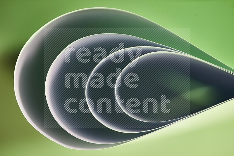 An abstract art of paper folded into smooth curves in green gradients