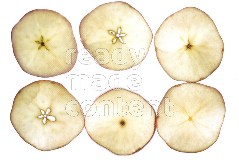 Apple slices on illuminated white background