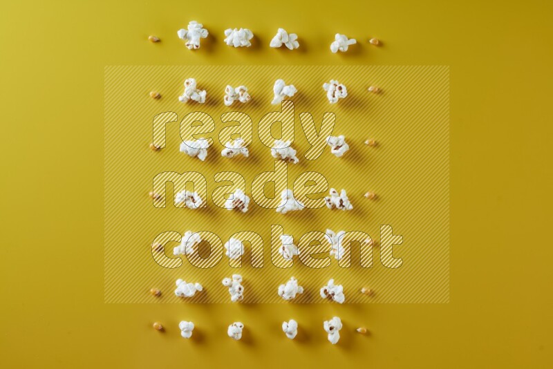 Popcorn flakes and seeds on a yellow background in different angles