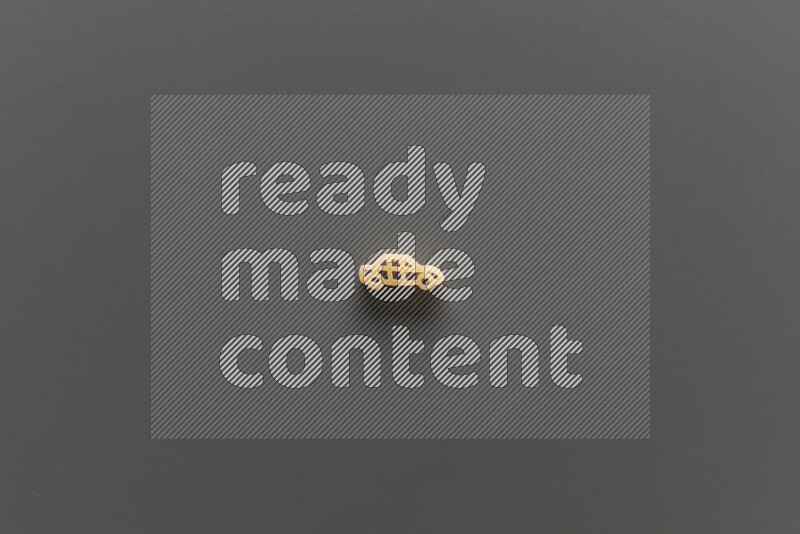 Shaped children pasta on grey background