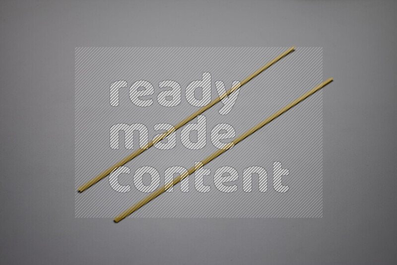 Linguini pasta on grey background