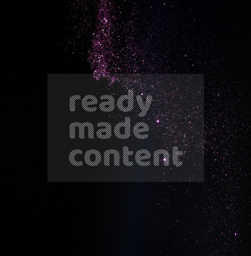 Pink glitter powder isolated on black background