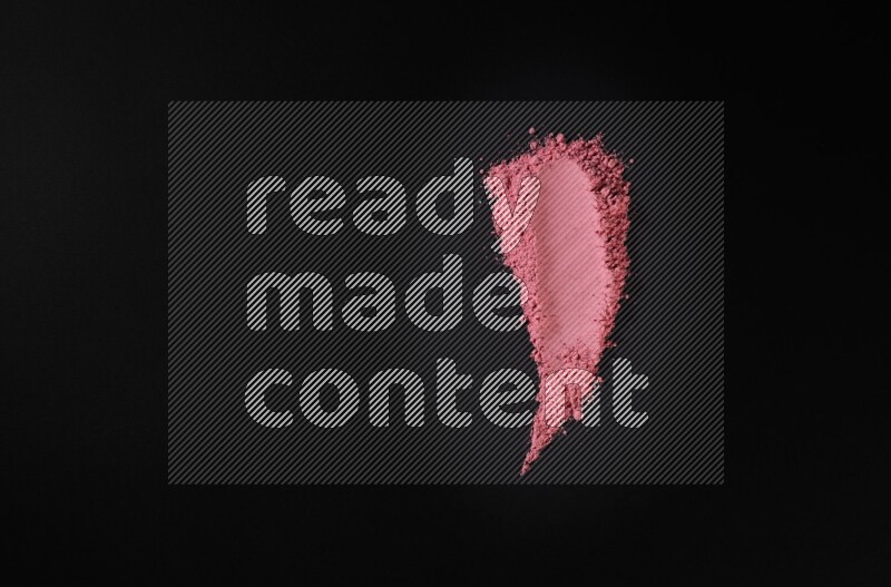 Red powder strokes on black background