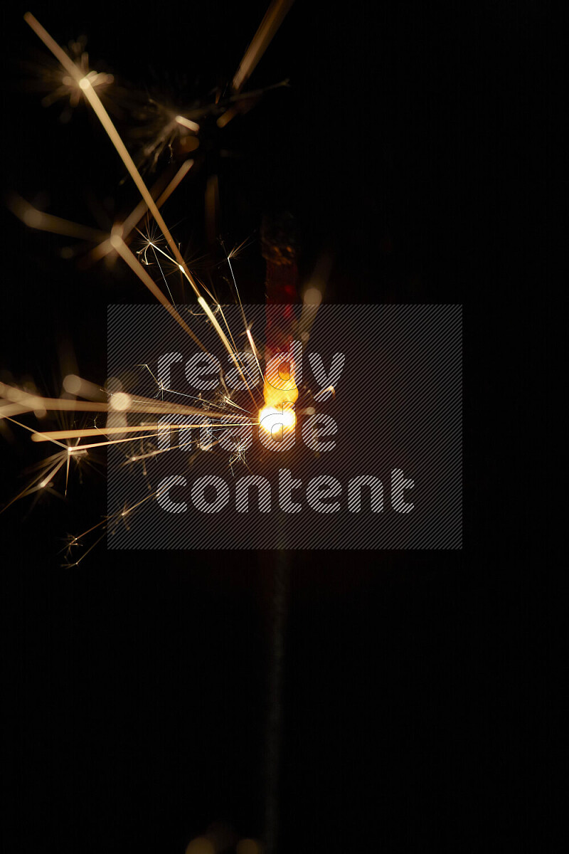 A close-up image of sparkler candle isolated on black background