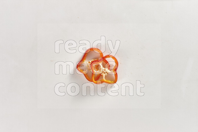 Red bell pepper slices on white background