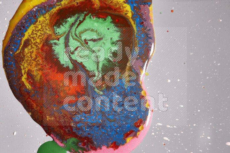 Close-ups of assorted colors blending on a grey background