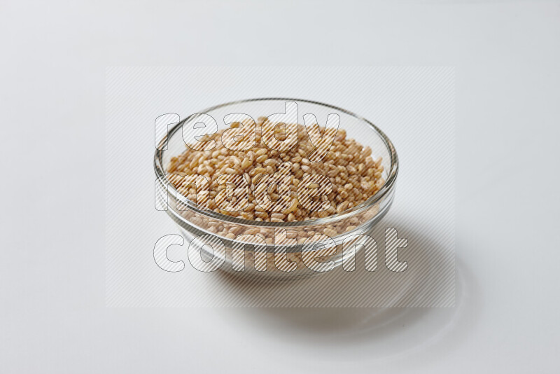 Hulled wheat on white background