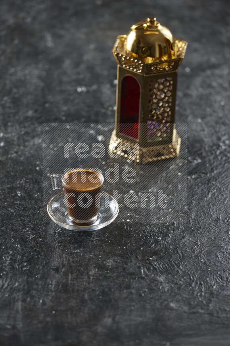 A golden lantern with different drinks, dates, nuts, prayer beads and quran on textured black background