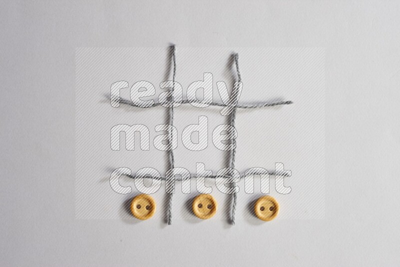 Wooden buttons placed on grey background
