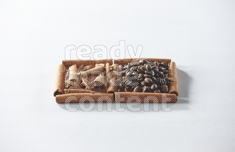 2 squares of cinnamon sticks full of coffee beans and cinnamon on white flooring