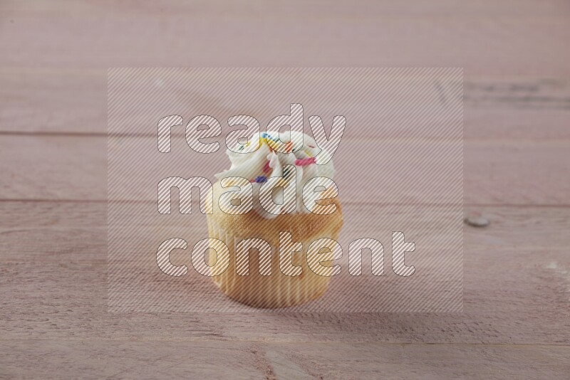 Vanilla mini cupcake topped with cream