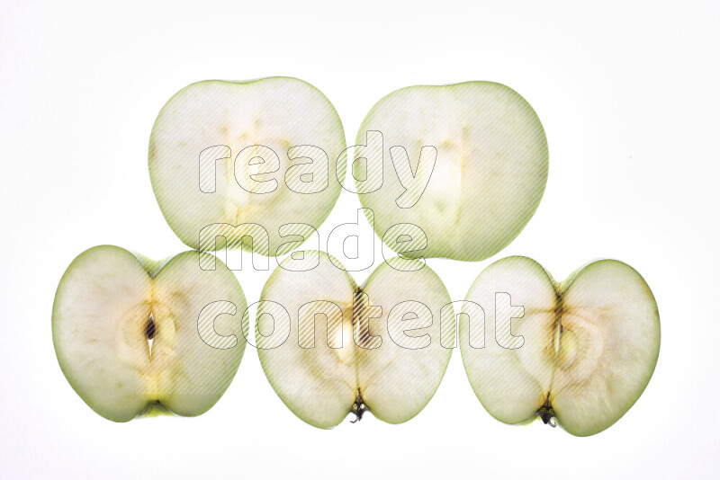 Apple slices on illuminated white background