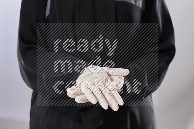 Female doctor wearing an abaya and medical attire in different positions