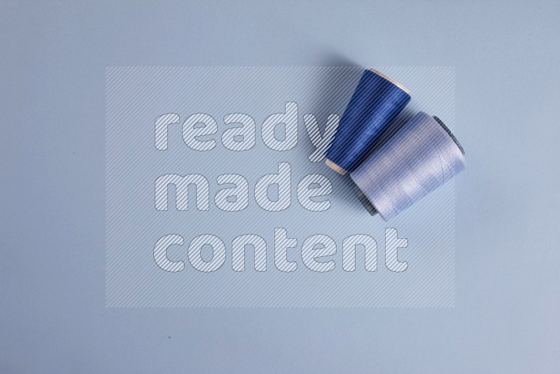 Blue sewing supplies on blue background