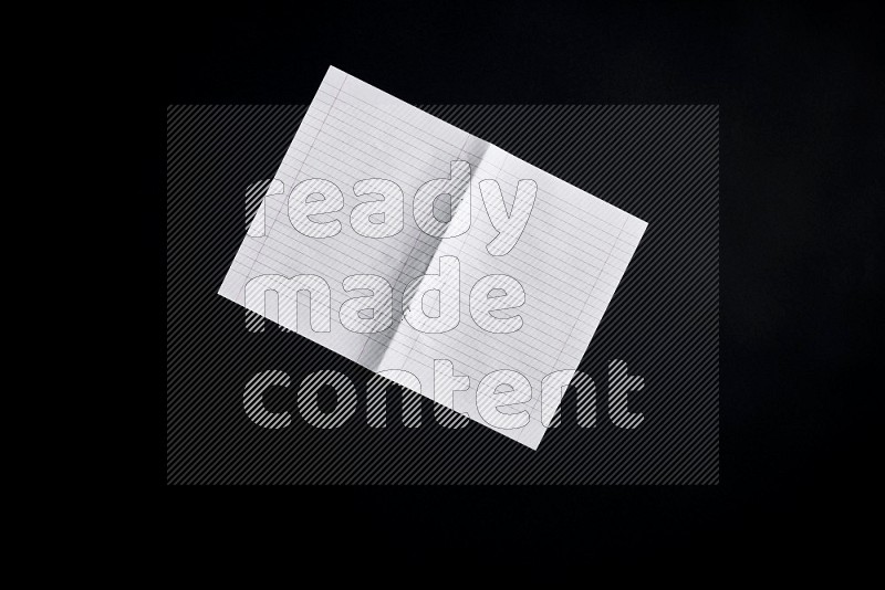 Notebook sheet on black background