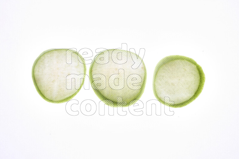 Apple slices on illuminated white background
