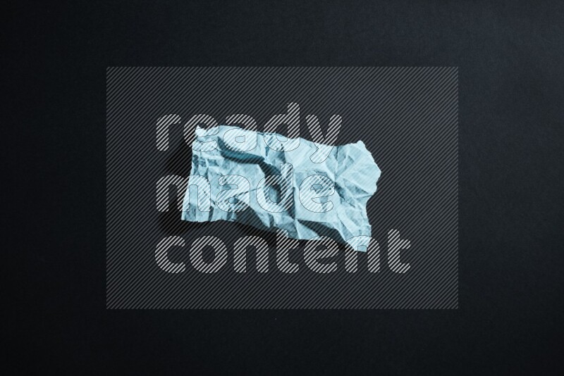 Blue paper sheet on black background