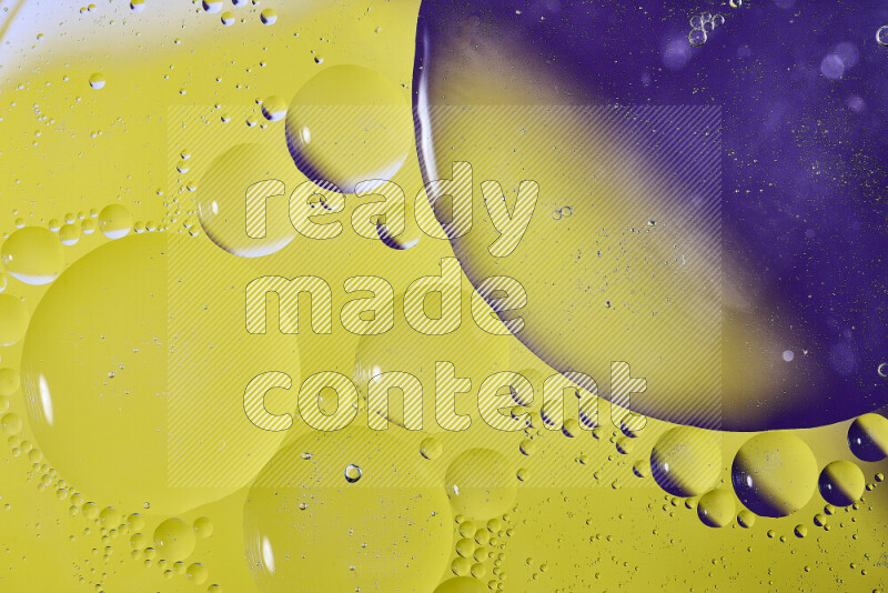 Close-ups of abstract oil bubbles on water surface in shades of purple and yellow