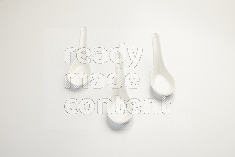 white ceramic soup spoon on white countertop