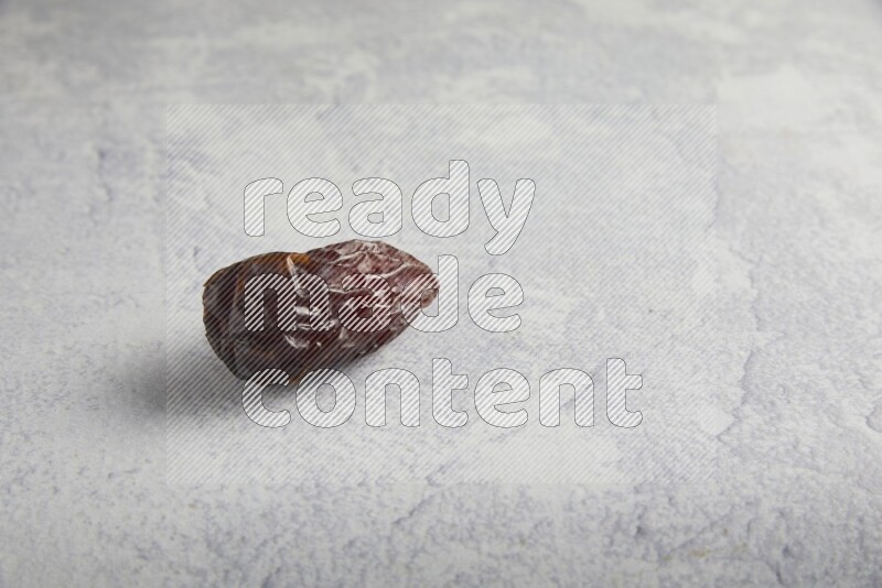 one madjoul date on a light grey background