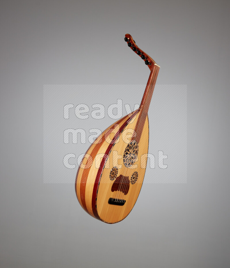 a wooden brown Oud on a gray background
