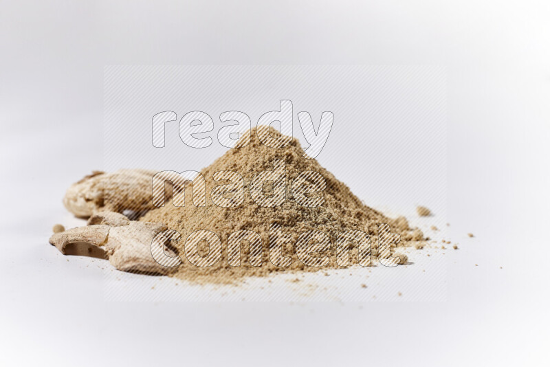 A bunch of ground ginger powder on white background