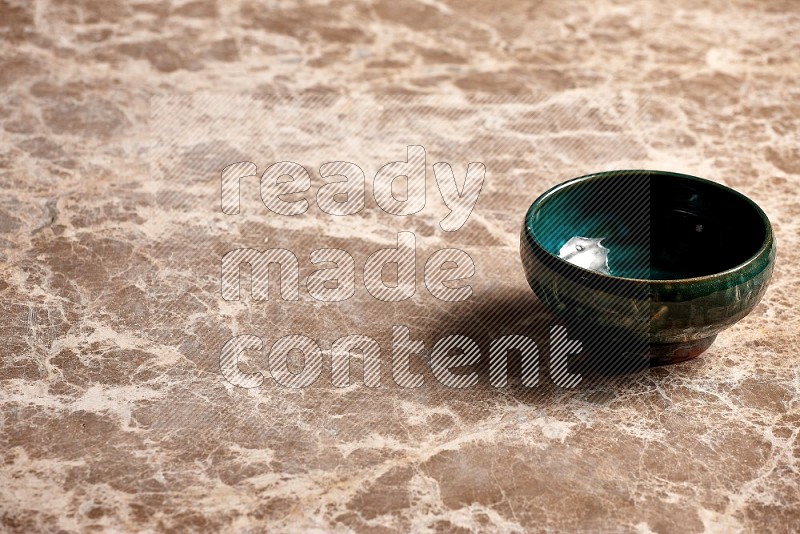 Dark Green Pottery Bowl on Beige Marble Flooring, 45 degrees