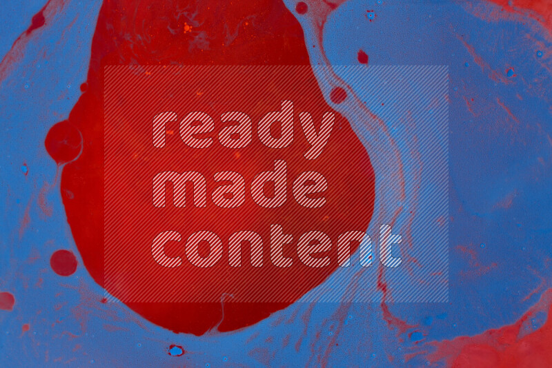 The image depicts a marbling effect with swirling patterns of red and blue