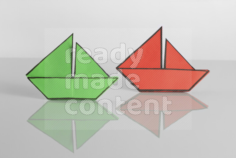 Origami boat on grey background