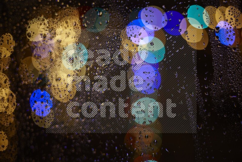 Bokeh light in multicolor with water drops