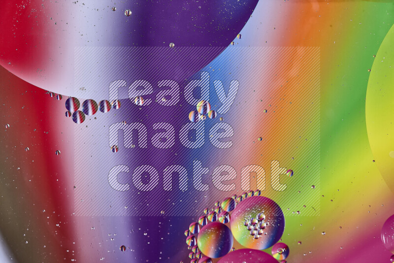 Close-ups of abstract oil bubbles on water surface in multicolors