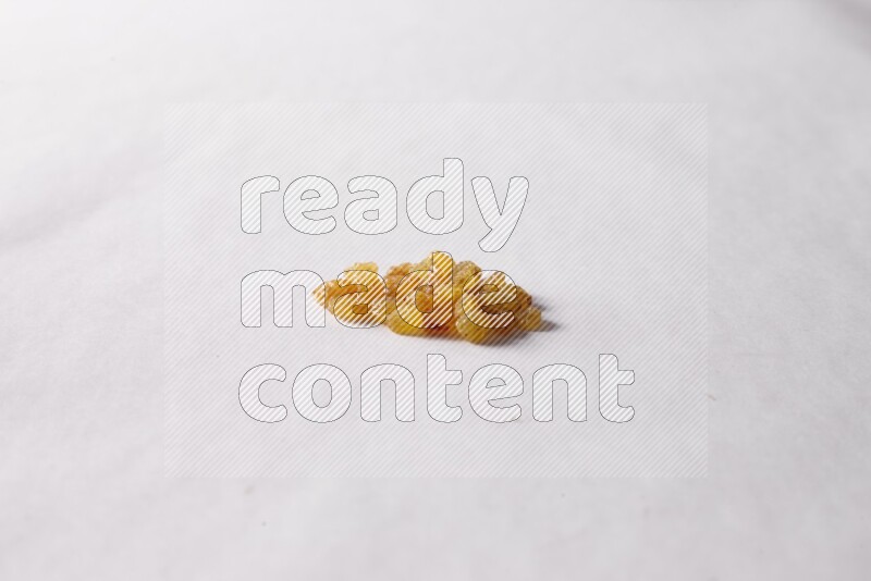 Raisins on white background