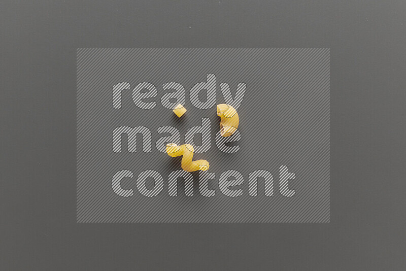 Different pasta types on grey background