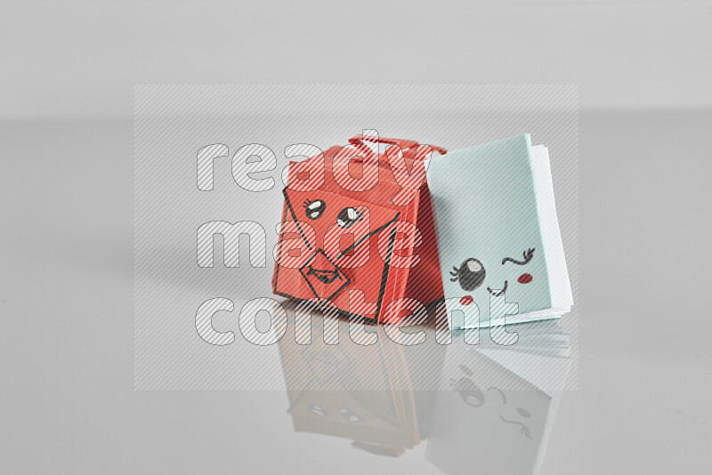 Origami school supplies such as back bag, books and ruler on grey background