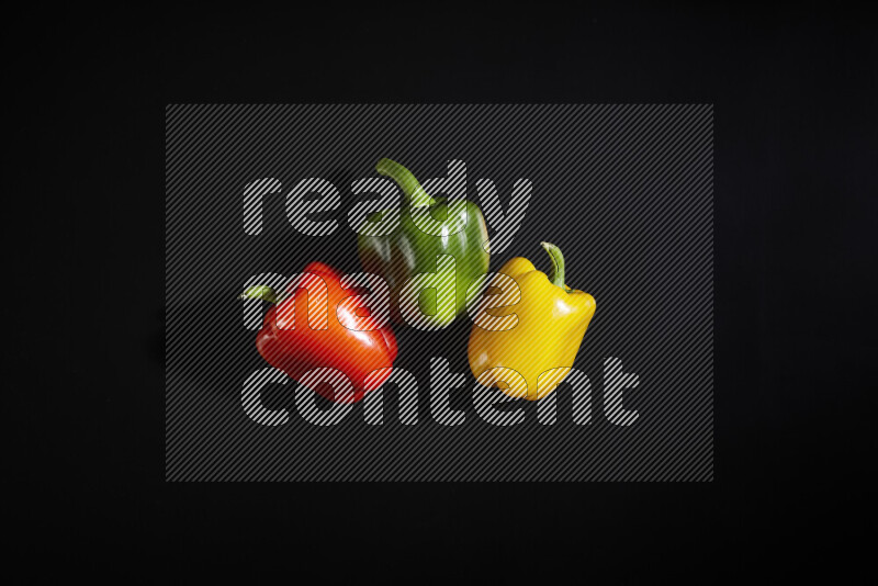 Assorted bell pepper on black background