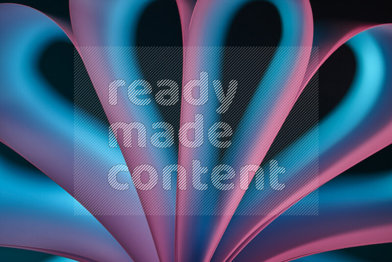 An abstract art piece displaying smooth curves in blue and pink gradients created by colored light