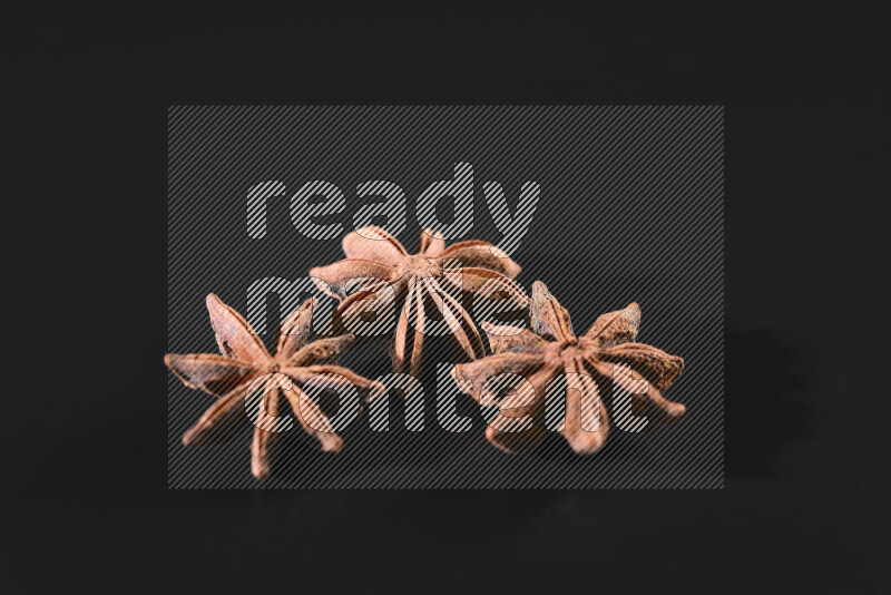 Star anise on black background