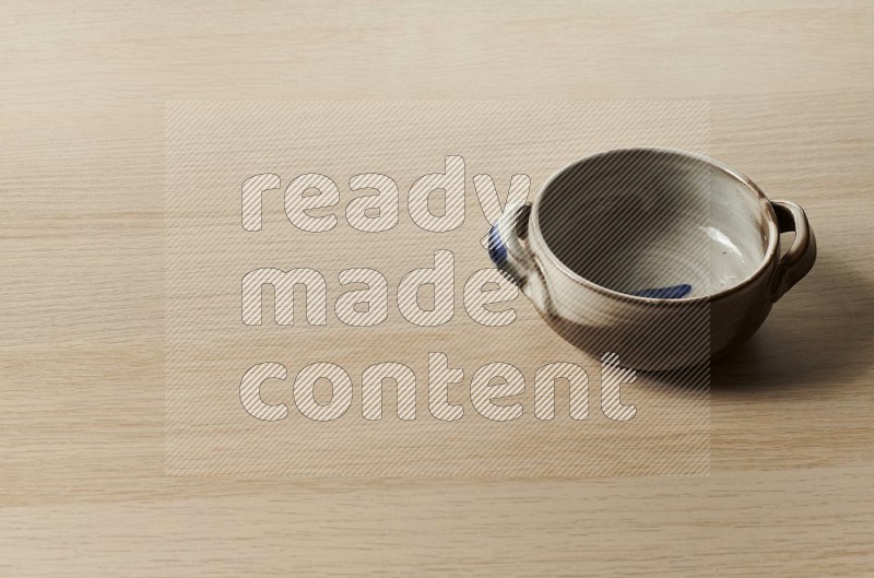 Multicolored Pottery Bowl on Oak Wooden Flooring, 45 degrees