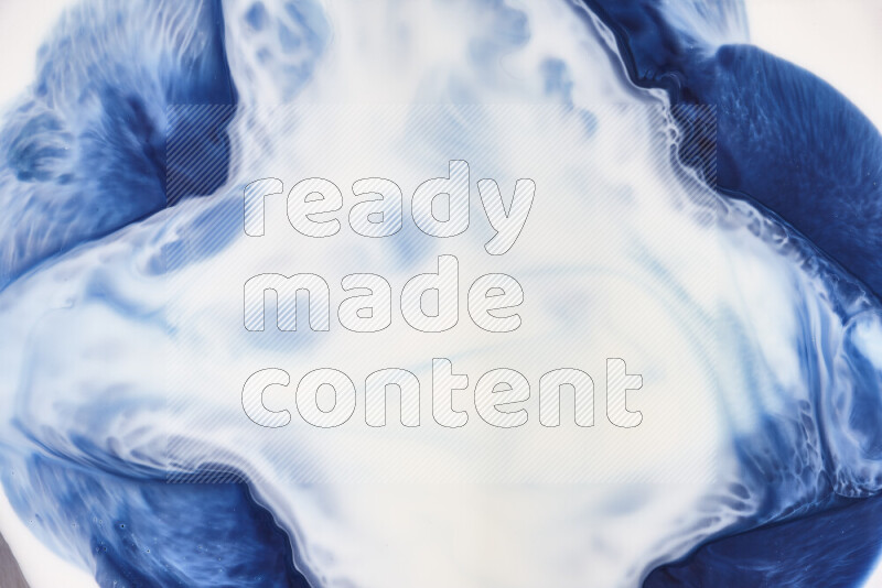 A close-up of abstract swirling patterns in blue and white