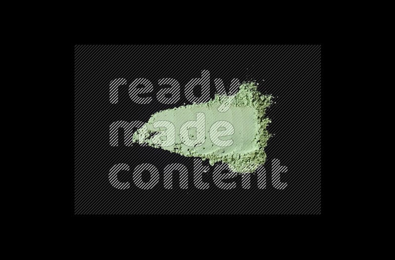 Green powder strokes on black background