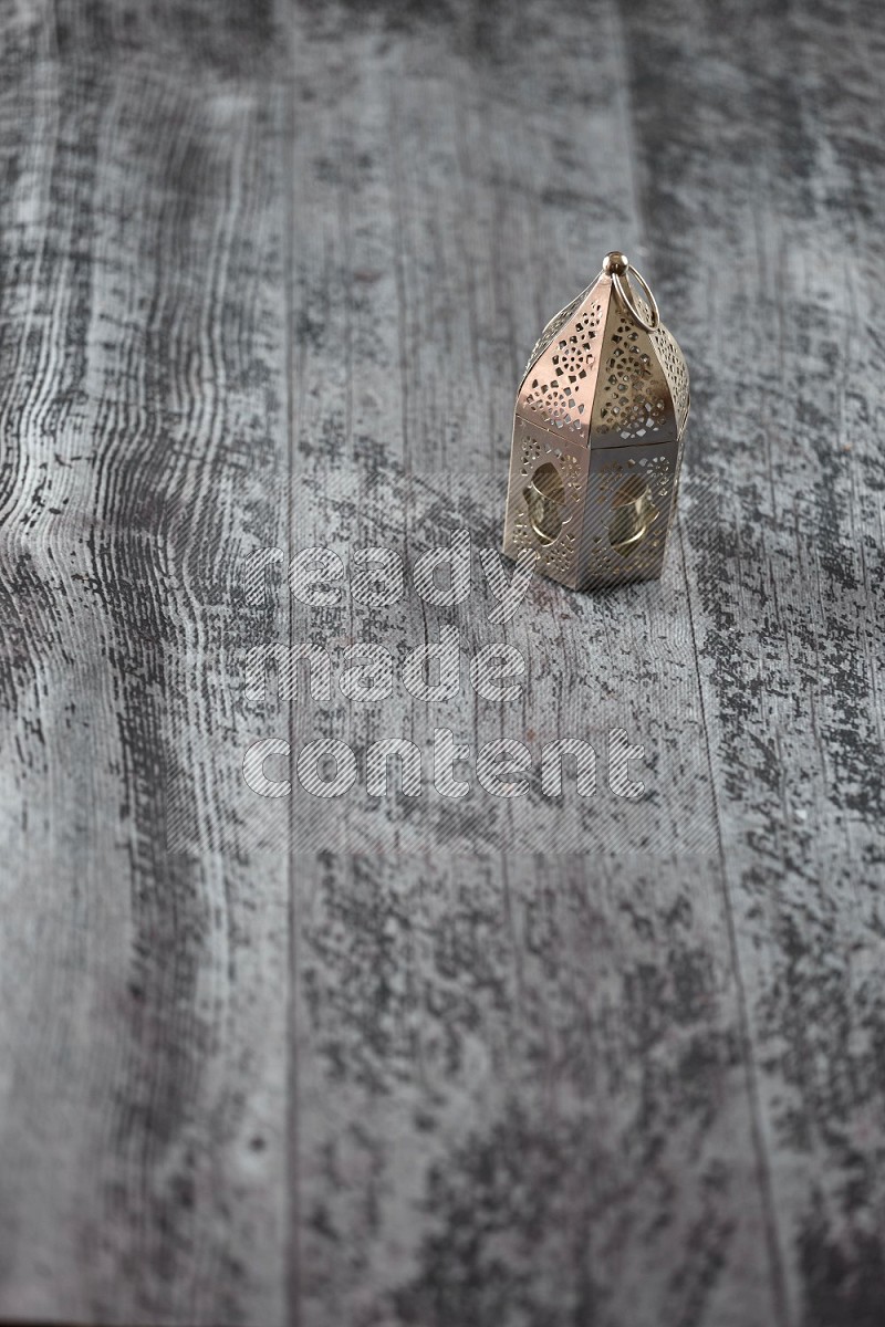 A lantern placed on a wooden background