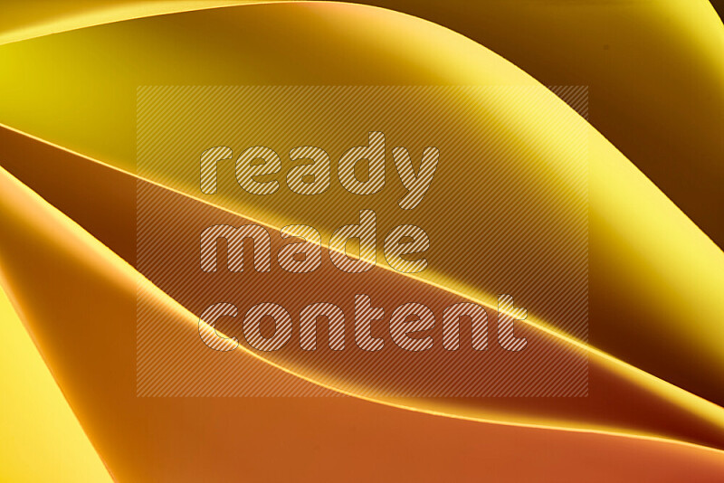 This image showcases an abstract paper art composition with paper curves in gold gradients created by colored light