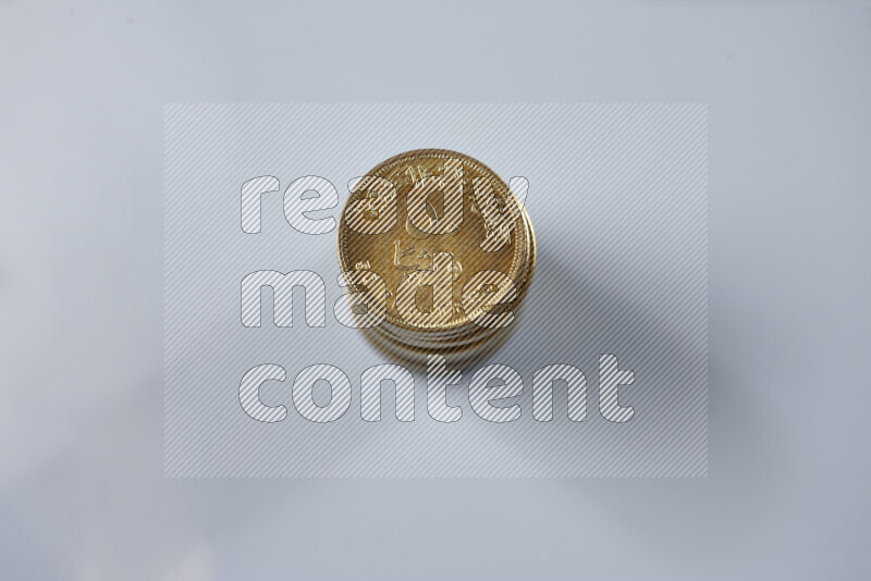 Stack Egyptian 50 piasters coins on grey background