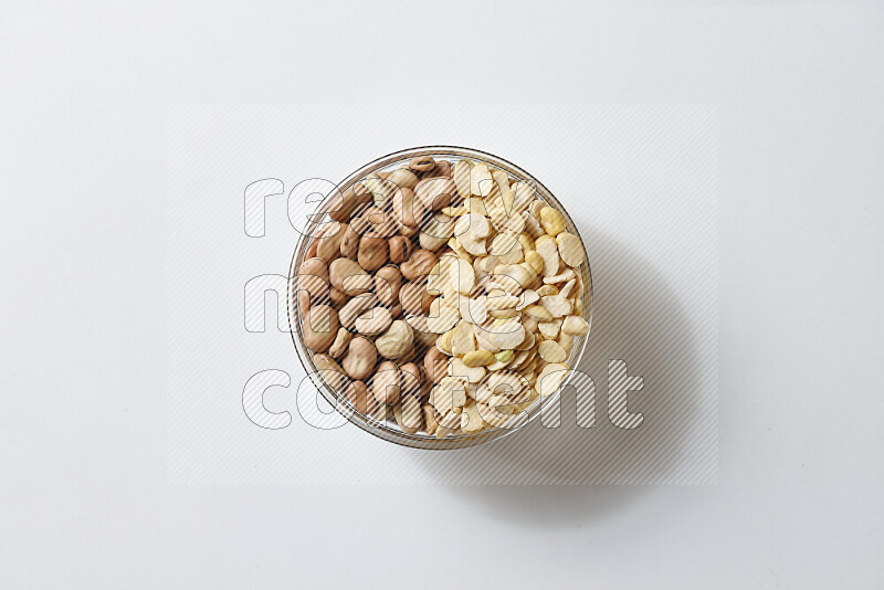 Fava beans with crushed beans on white background