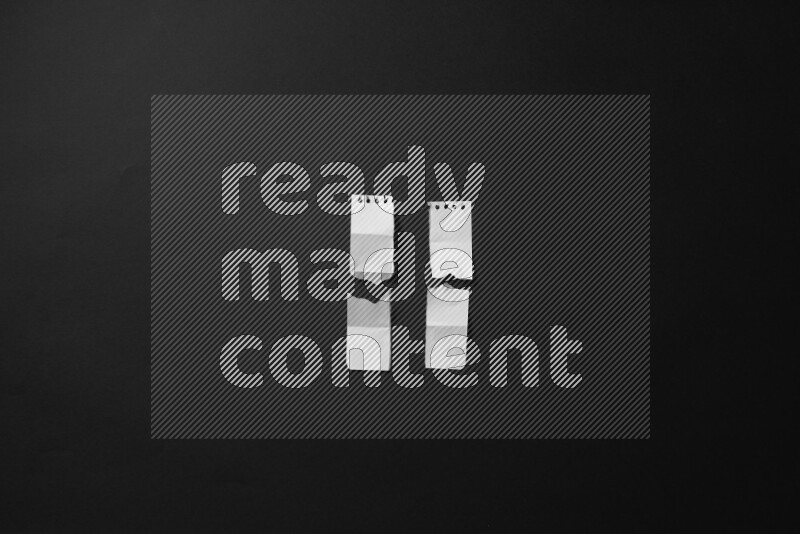 Ripped notebook sheet on black background