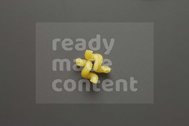 Twist pasta on grey background